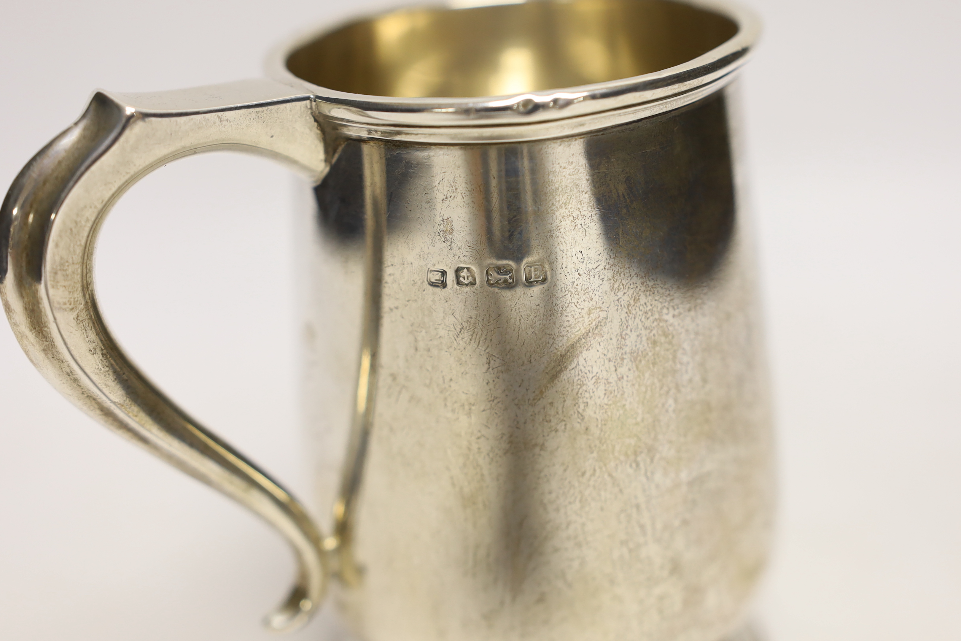 A George V silver mug, with engraved armorial, A & J Zimmerman, Birmingham, 1930, 13cm, 9oz.